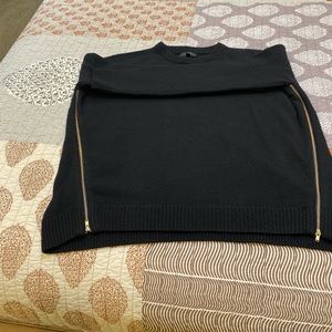 Woman’s black J. Crew crew neck sweater.